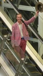 I'm A Celebrity Get Me Out of Here finalist Nigel Farage cuts a stylish figure in a pink outfit as he's pictured with his daughter Isabelle Farage and his girlfriend Laure Ferrari departing Australia after appearing in this year's live show!