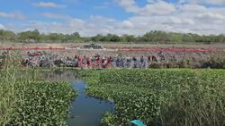 Dozens of migrants blocked by barbed wire on Mexico-US border - AFP