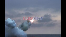 PHOTOS : North Korea's Kim oversees test of cruise missiles - AFP