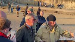 Nigel Farage got into an armoured vehicle on the beaches at Arronmanches-Les-Bains surrounded by veterans and tourists.