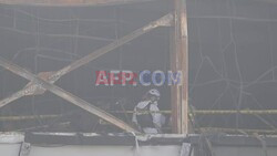 Rescue workers at scene of deadly South Korea factory fire - AFP