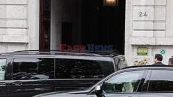 Taylor Swift covers with umbrellas while arriving at Casa Cipriani hotel in Milan.