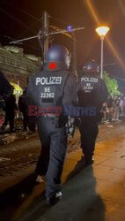 Police moving England fans on as they are singing and chanting in the streets of Berlin ahead of the UEFA EURO 2024 final between Spain and England