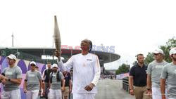 Snoop Dogg Carries Olympic Torch In Paris