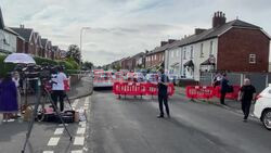 Flowers left at scene of Southport stabbing in which two children killed - AFP