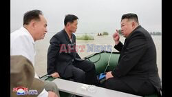 PHOTOS: North Korean leader Kim inspects flooded area on rubber boat - AFP