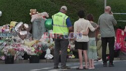 People mourn victims of UK knife attack that killed three children - AFP