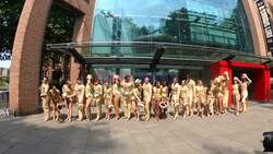 The entire cast of A Chorus Line (19 dancers), including Adam Cooper and Carly Mercedes Dyer, pose outside Sadler’s Wells in full costume, to form a literal chorus line into the venue.