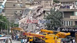 Emergency crews at the site where a building collapsed in Cairo - AFP