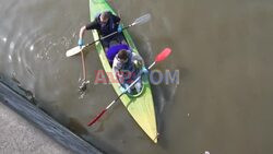 Volunteers use kayaks to clean up Brussels Canal - AFP