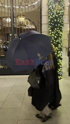 *EXCLUSIVE* Mary Kate Olsen and Ashley Olsen hide behind their umbrella while returning to the Ritz in Paris, France.