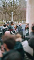 Naomi Scott sharing love with her husband Jordan Spence while leaving Dior fashion show during Paris Fashion Week.