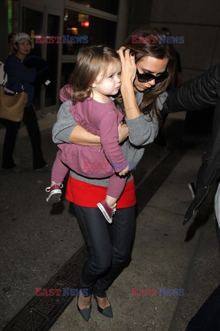 Victoria Beckham and baby Harper get mobbed by photographers at LAX airport