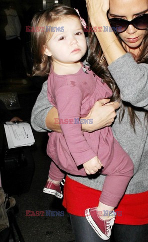Victoria Beckham and baby Harper get mobbed by photographers at LAX airport