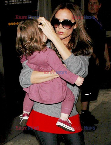 Victoria Beckham and baby Harper get mobbed by photographers at LAX airport