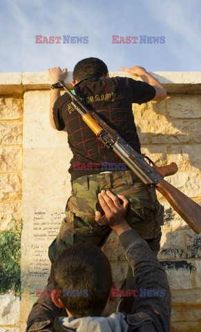 Free Syrian Army youth soldiers attend a training camp 