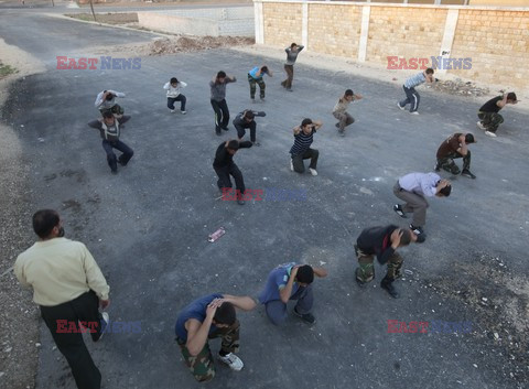 Free Syrian Army youth soldiers attend a training camp 