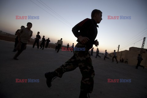 Free Syrian Army youth soldiers attend a training camp 