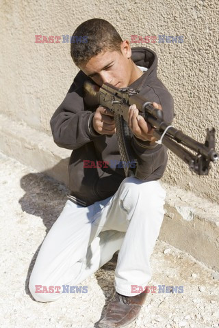 Free Syrian Army youth soldiers attend a training camp 