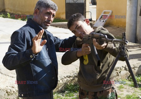 Free Syrian Army youth soldiers attend a training camp 