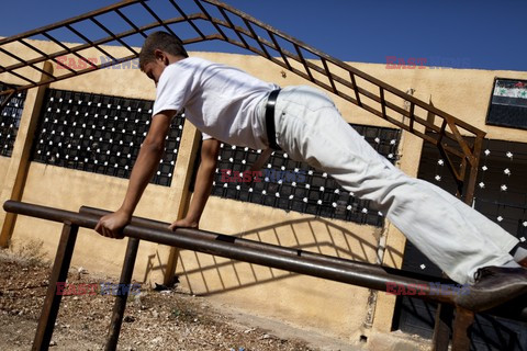 Free Syrian Army youth soldiers attend a training camp 