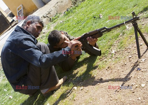 Free Syrian Army youth soldiers attend a training camp 