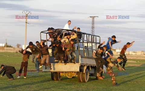 Free Syrian Army youth soldiers attend a training camp 