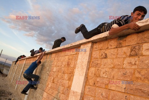 Free Syrian Army youth soldiers attend a training camp 