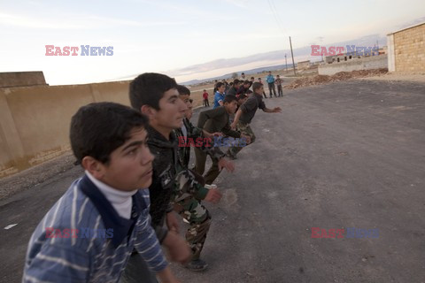 Free Syrian Army youth soldiers attend a training camp 