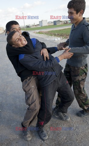 Free Syrian Army youth soldiers attend a training camp 