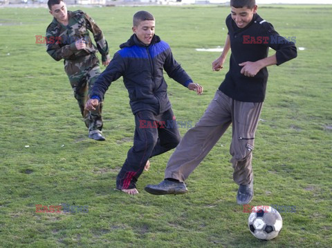 Free Syrian Army youth soldiers attend a training camp 