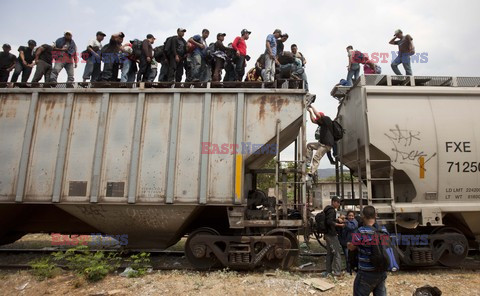 Migrants riding on top of train toward the US-Mexico border