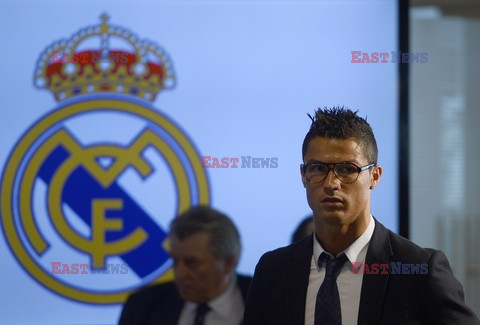 Cristiano Ronaldo smiles after signing the renewal of his contract 