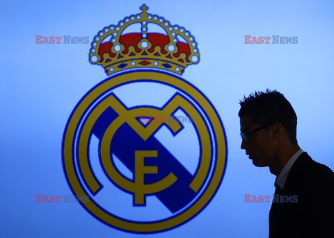 Cristiano Ronaldo smiles after signing the renewal of his contract 