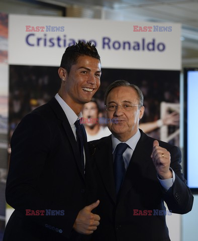 Cristiano Ronaldo smiles after signing the renewal of his contract 