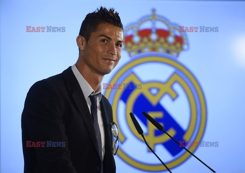 Cristiano Ronaldo smiles after signing the renewal of his contract 