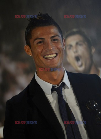 Cristiano Ronaldo smiles after signing the renewal of his contract 