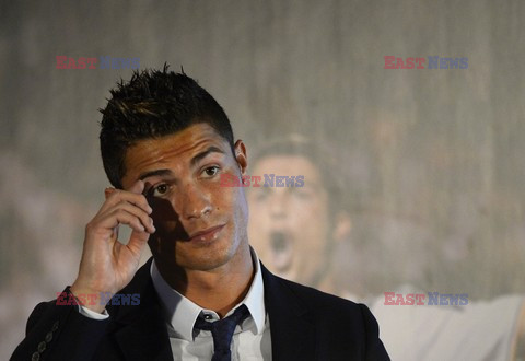 Cristiano Ronaldo smiles after signing the renewal of his contract 