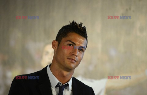 Cristiano Ronaldo smiles after signing the renewal of his contract 