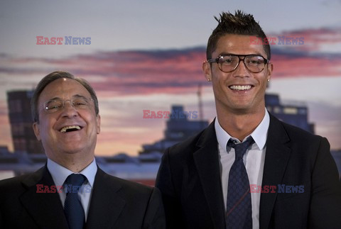 Cristiano Ronaldo smiles after signing the renewal of his contract 