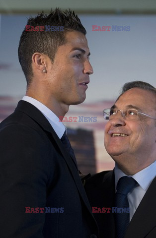 Cristiano Ronaldo smiles after signing the renewal of his contract 