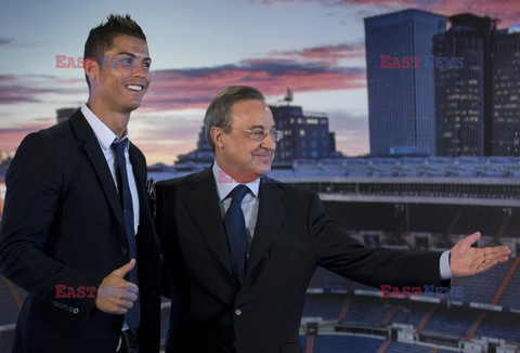 Cristiano Ronaldo smiles after signing the renewal of his contract 