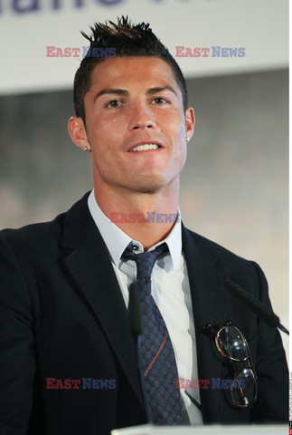 Cristiano Ronaldo smiles after signing the renewal of his contract 