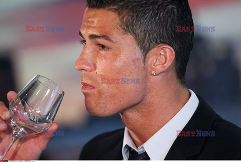 Cristiano Ronaldo smiles after signing the renewal of his contract 