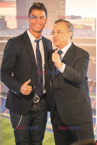 Cristiano Ronaldo smiles after signing the renewal of his contract 