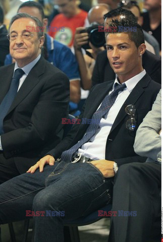 Cristiano Ronaldo smiles after signing the renewal of his contract 