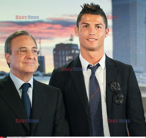 Cristiano Ronaldo smiles after signing the renewal of his contract 