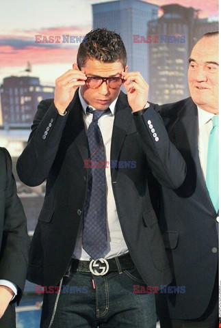 Cristiano Ronaldo smiles after signing the renewal of his contract 