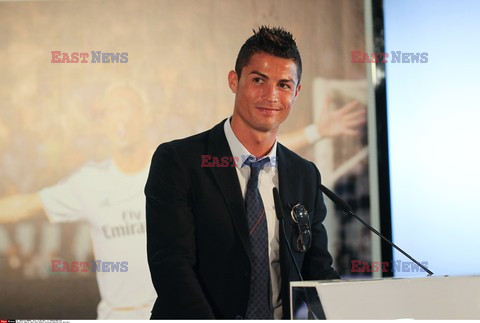 Cristiano Ronaldo smiles after signing the renewal of his contract 