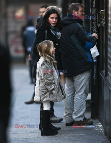 Courteney Cox and her daughter taking a walk